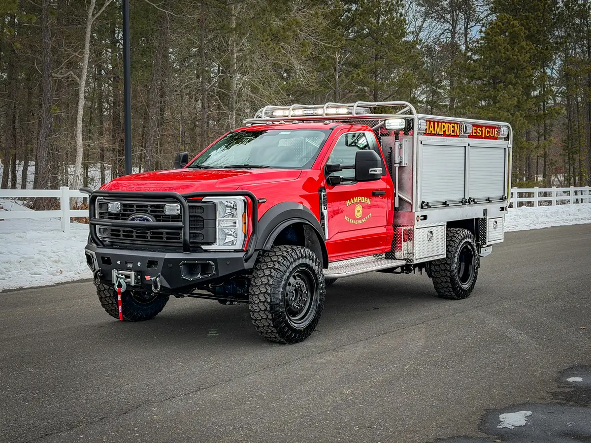 Front passenger-side three-quarter view with side body compartments.